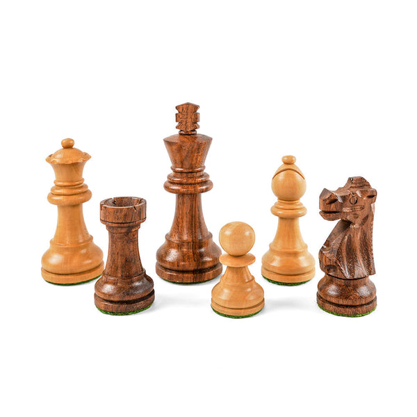 Acacia and boxwood Staunton chess pieces with felted bases beside their storage box